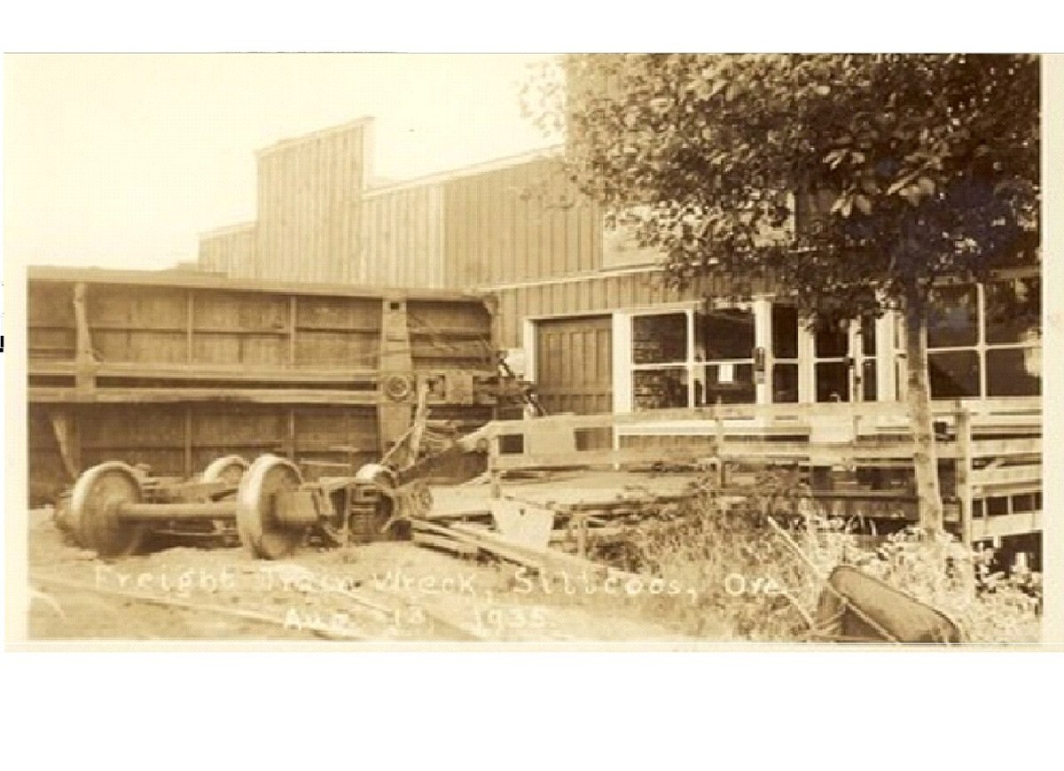 Wreckage after the 1935 derailment at Siltcoos Station, Oregon; a boxcar lies off the rails