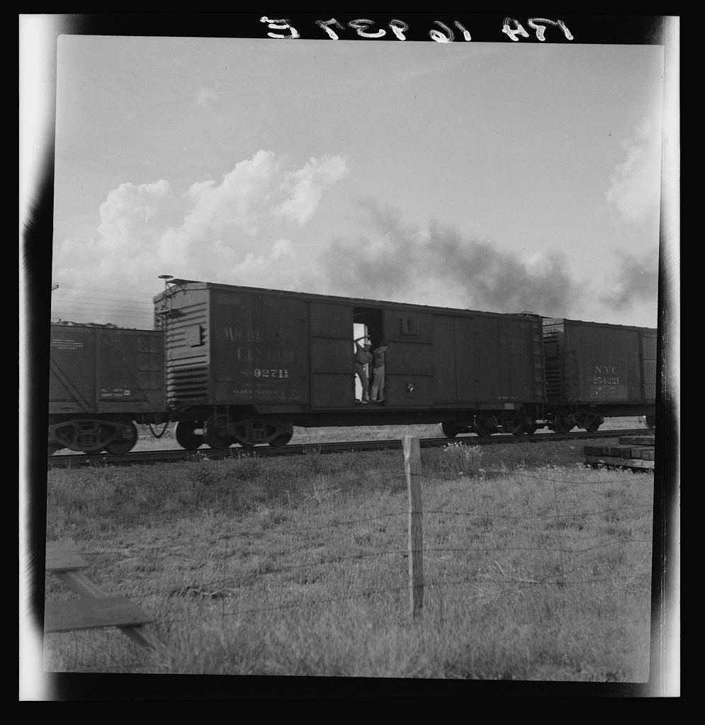 Boy riding freight, West Texas