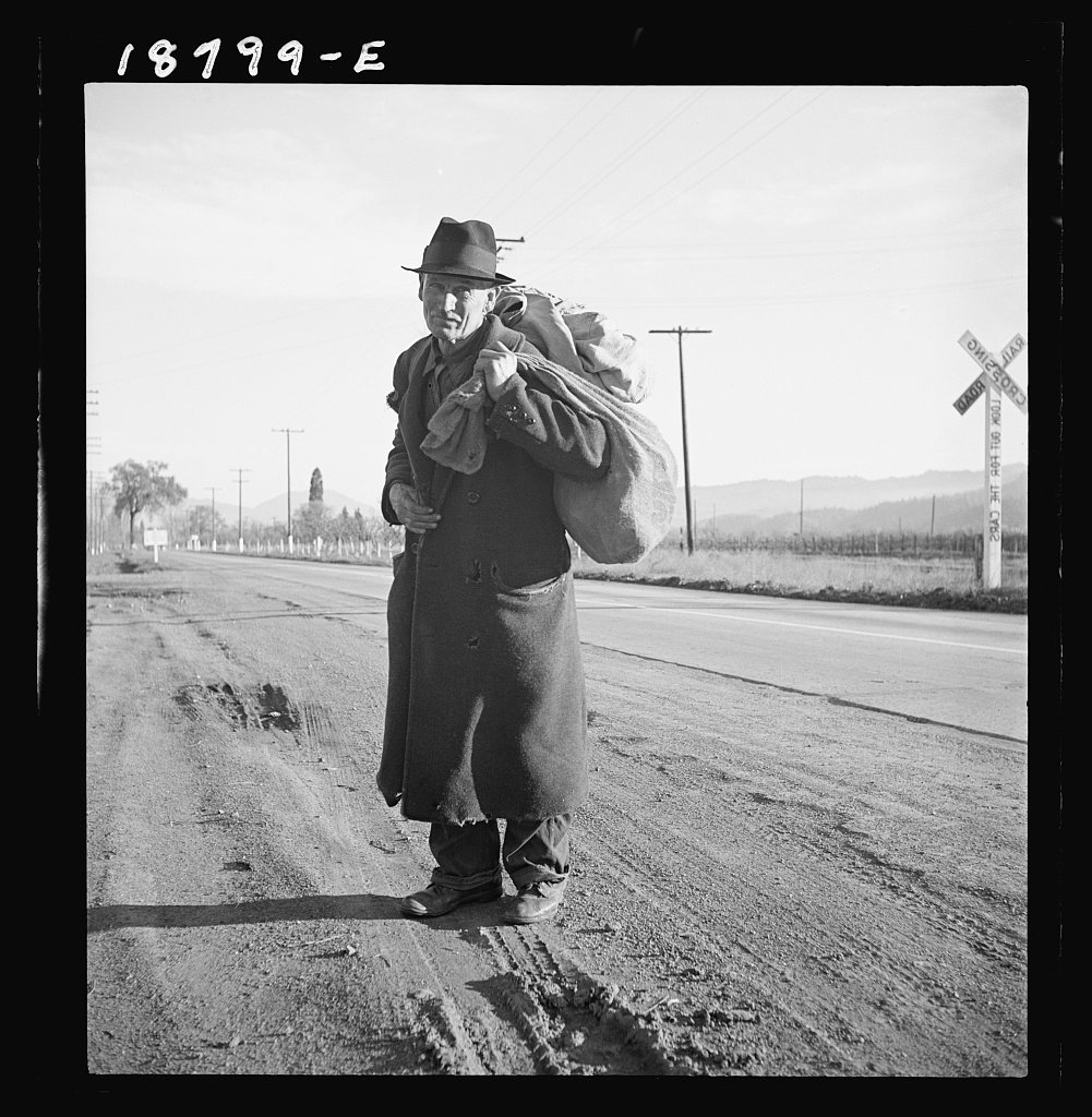 Bindle stiff standing by a railroad crossing, Napa Valley, California